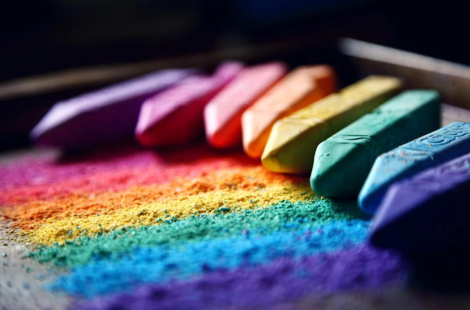 Pieces of chalk in rainbow colors 