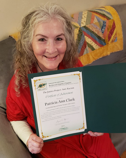 Ann Clark and her certificate of achievement for completing the Justice Project. 