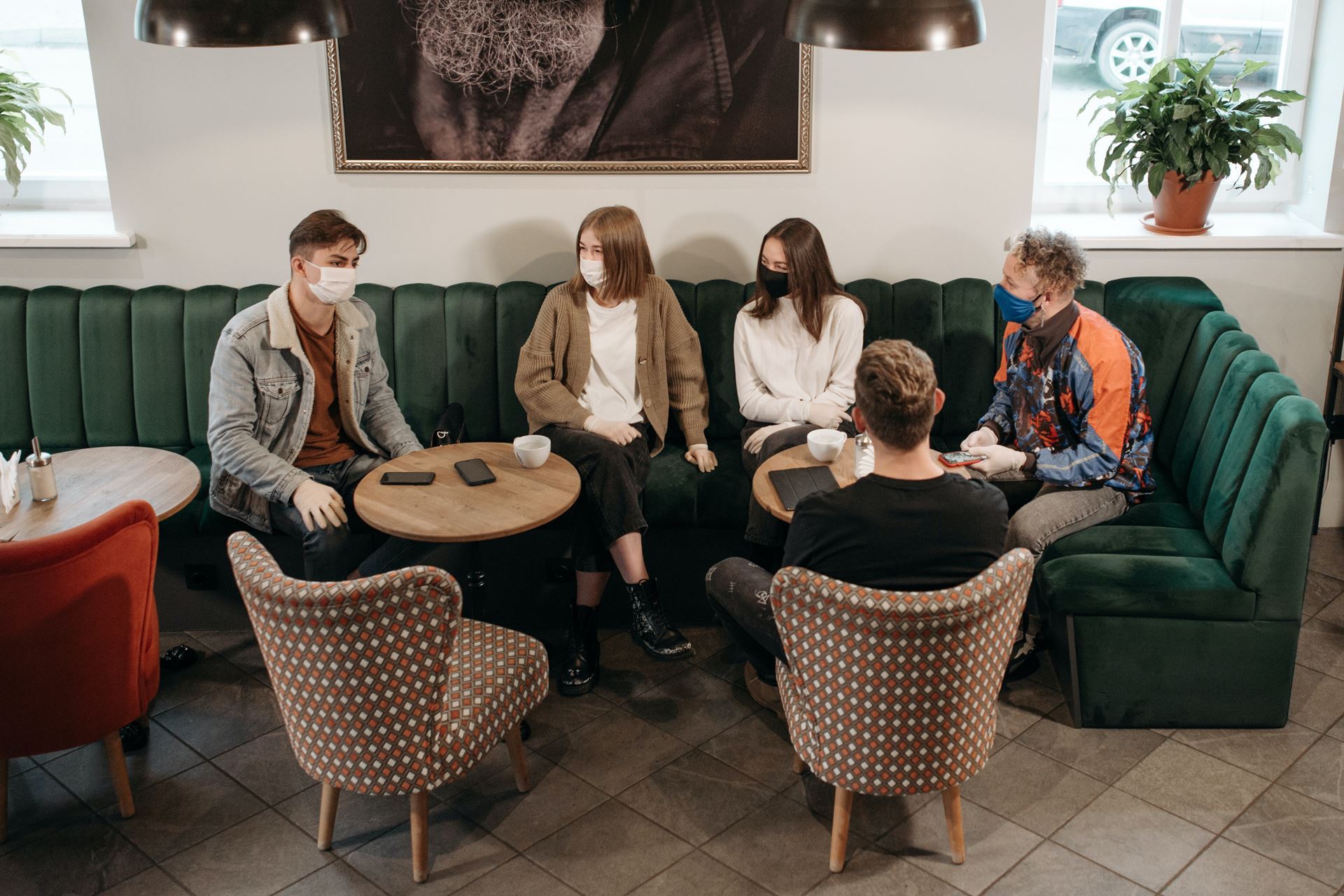 group of people sitting at coffee shop